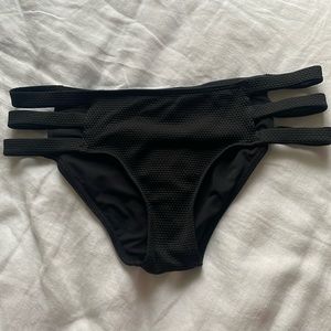 Black swimsuit bottom with cutout side detail